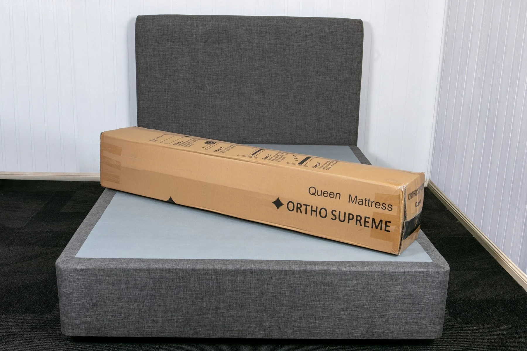 Boxed mattress placed on a bed base